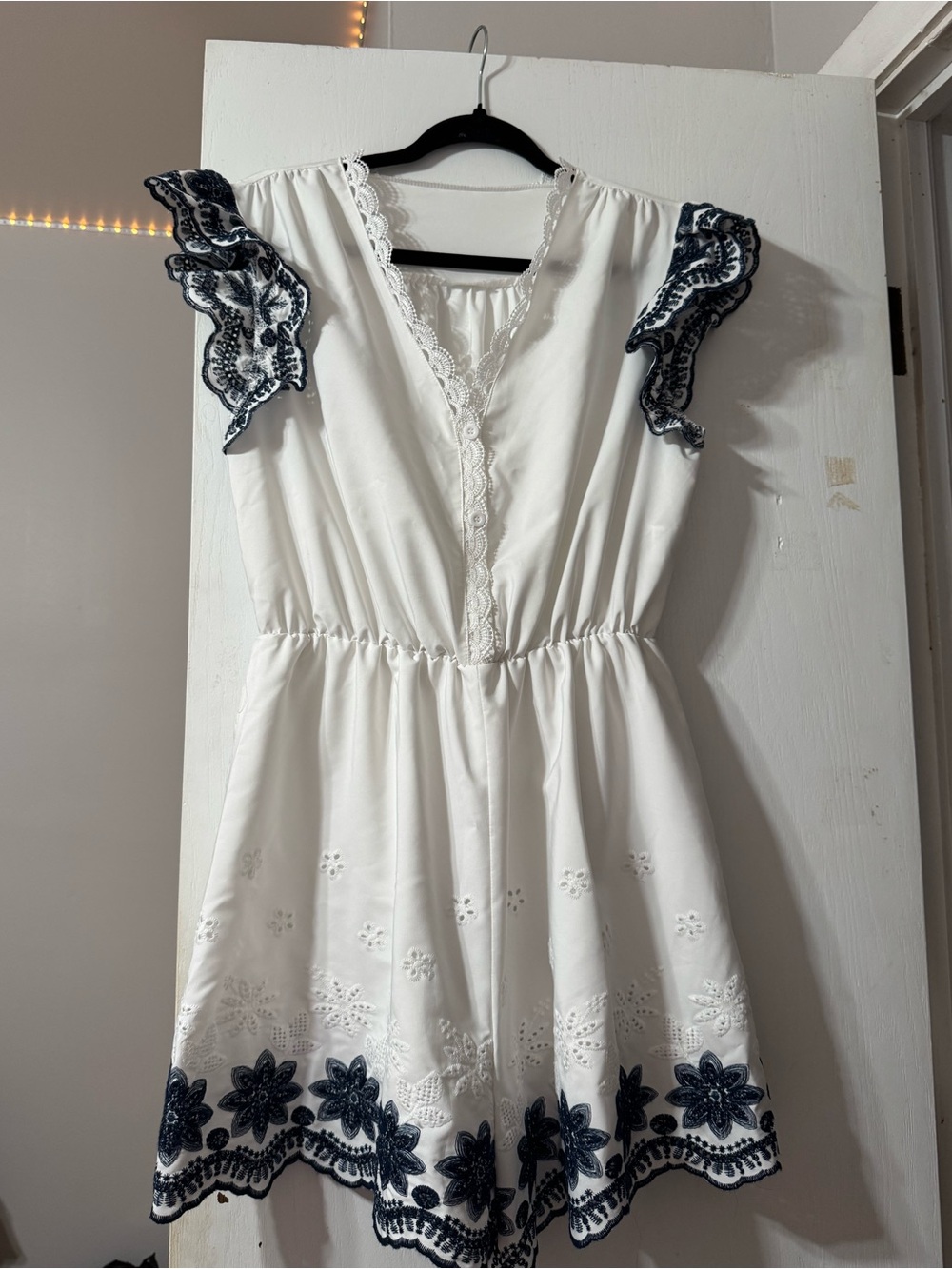 White Romper with Navy Floral Trim